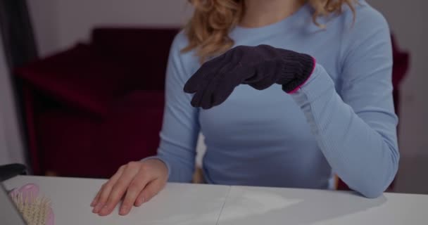 Faceless Woman Takes Her Protective Glove Places Table Next Her — Stock Video