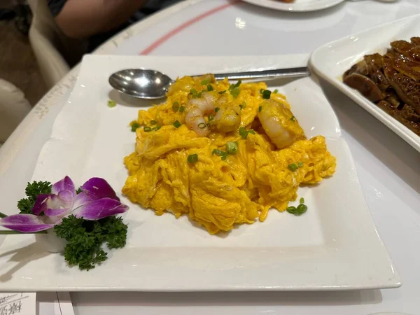 Scrambled Eggs with Shrimps. Famous Cantonese food style