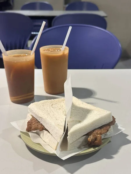 Cantonese food, Pork Chop Sandwich with ice milk tea and ice lemon tea.