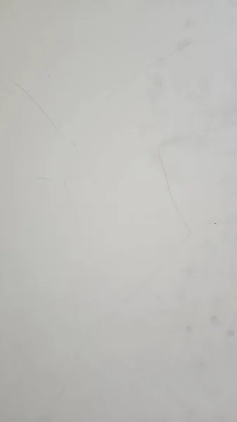 Foto Uma Parede Branca Com Ossos Rachados — Fotografia de Stock