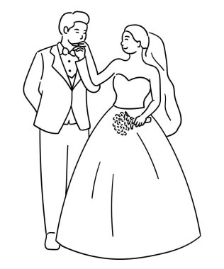 Gelin ve damat, damat gelinin elini öpüyor.