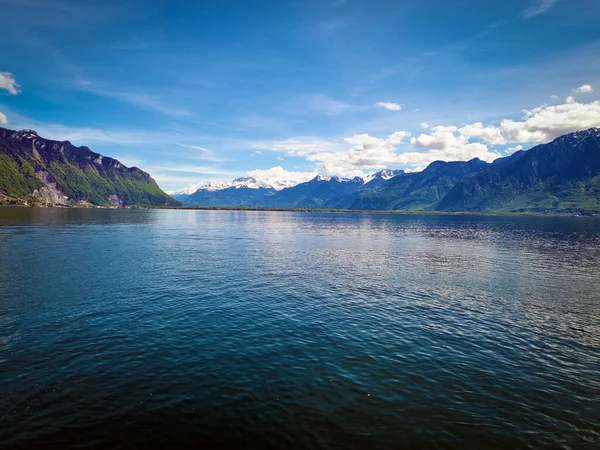 stock image Mountain lake. Green mountains. Nature in the mountains. Blue Lake. Mountain landscape with a lake. Mountain lake with clear water.