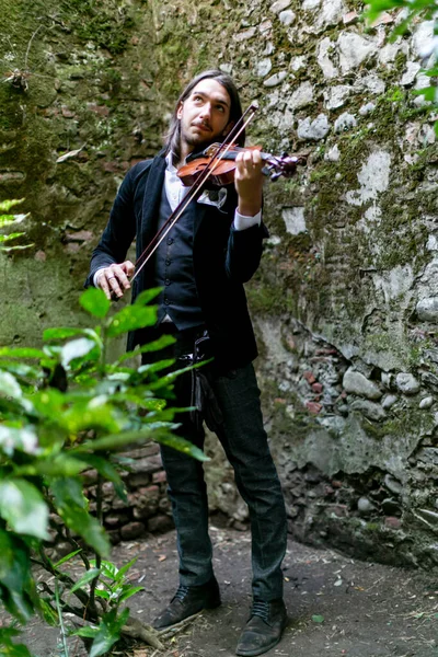 stock image Lucca, Italy - 2018 10 31 : Lucca Comics free cosplay event around city elegant boy playing the violin. High quality photo