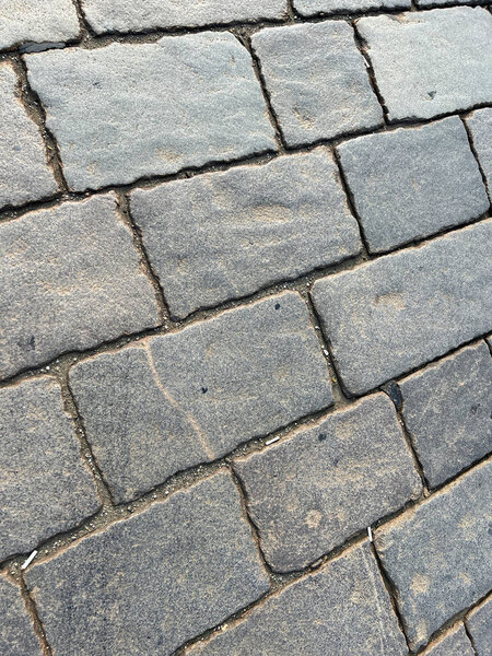 Cobblestone floor with Roman-style stones in the center of Turin . High quality photo