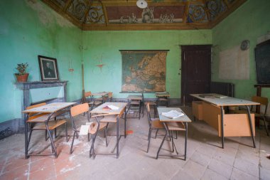 desks and chairs in abandoned school. High quality photo