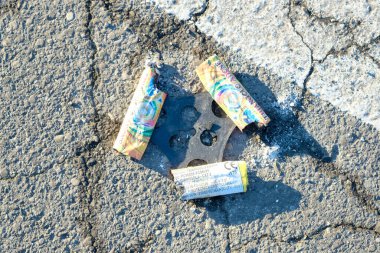leftovers from the end of the year fireworks left on the street litter. High quality photo