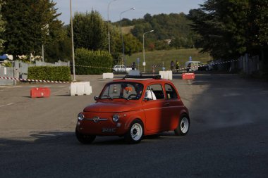 Bibbiano-Reggio Emilia Italy - 07 15 2015 : Free rally of vintage cars in the town square Fiat 500 Orange. High quality photo
