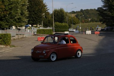 Bibbiano-Reggio Emilia Italy - 07 15 2015 : Free rally of vintage cars in the town square Fiat 500 Orange. High quality photo