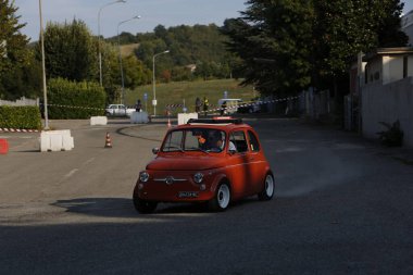 Bibbiano-Reggio Emilia Italy - 07 15 2015 : Free rally of vintage cars in the town square Fiat 500 Orange. High quality photo