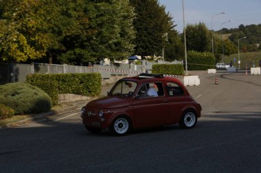 Bibbiano-Reggio Emilia Italy - 07 15 2015 : Free rally of vintage cars in the town square Fiat 500 Orange. High quality photo
