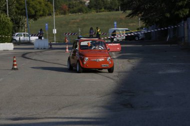 Bibbiano-Reggio Emilia Italy - 07 15 2015 : Free rally of vintage cars in the town square Fiat 500 Orange. High quality photo