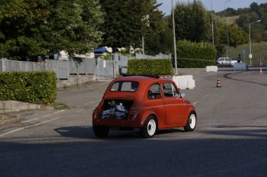 Bibbiano-Reggio Emilia Italy - 07 15 2015 : Free rally of vintage cars in the town square Fiat 500 Orange. High quality photo