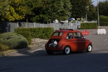 Bibbiano-Reggio Emilia Italy - 07 15 2015 : Free rally of vintage cars in the town square Fiat 500 Orange. High quality photo