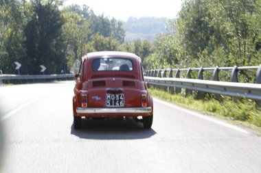 Bibbiano-Reggio Emilia Italy - 07 15 2015 : Free rally of vintage cars in the town square Fiat 500 Orange. High quality photo