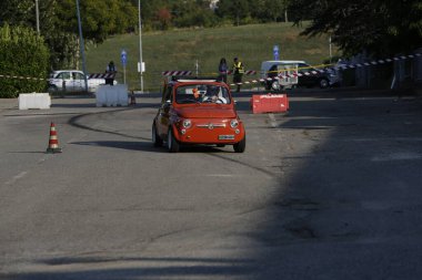 Bibbiano-Reggio Emilia Italy - 07 15 2015 : Free rally of vintage cars in the town square Fiat 500 Orange. High quality photo