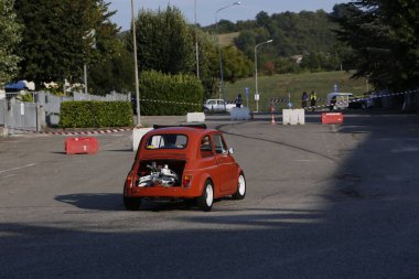 Bibbiano-Reggio Emilia Italy - 07 15 2015 : Free rally of vintage cars in the town square Fiat 500 Orange. High quality photo