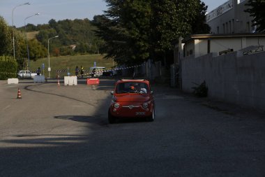 Bibbiano-Reggio Emilia Italy - 07 15 2015 : Free rally of vintage cars in the town square Fiat 500 Orange. High quality photo