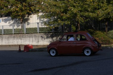 Bibbiano-Reggio Emilia Italy - 07 15 2015 : Free rally of vintage cars in the town square Fiat 500 Orange. High quality photo