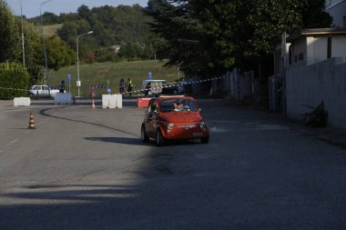Bibbiano-Reggio Emilia Italy - 07 15 2015 : Free rally of vintage cars in the town square Fiat 500 Orange. High quality photo