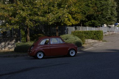 Bibbiano-Reggio Emilia Italy - 07 15 2015 : Free rally of vintage cars in the town square Fiat 500 Orange. High quality photo
