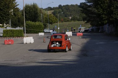 Bibbiano-Reggio Emilia Italy - 07 15 2015 : Free rally of vintage cars in the town square Fiat 500 Orange. High quality photo