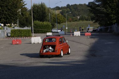 Bibbiano-Reggio Emilia Italy - 07 15 2015 : Free rally of vintage cars in the town square Fiat 500 Orange. High quality photo