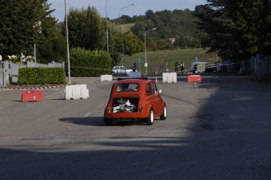 Bibbiano-Reggio Emilia Italy - 07 15 2015 : Free rally of vintage cars in the town square Fiat 500 Orange. High quality photo