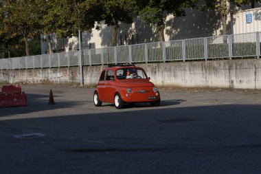 Bibbiano-Reggio Emilia Italy - 07 15 2015 : Free rally of vintage cars in the town square Fiat 500 Orange. High quality photo