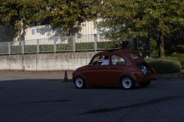 Bibbiano-Reggio Emilia Italy - 07 15 2015 : Free rally of vintage cars in the town square Fiat 500 Orange. High quality photo