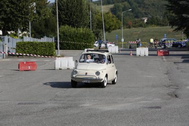 Bibbiano-Reggio Emilia Italy - 07 15 2015 : Free rally of vintage cars in the town square white Fiat 500. High quality photo