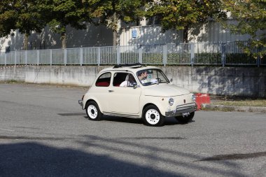Bibbiano-Reggio Emilia Italy - 07 15 2015 : Free rally of vintage cars in the town square white Fiat 500. High quality photo