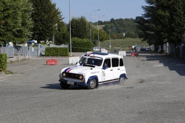 Bibbiano-Reggio Emilia Italy - 07 15 2015 : Free rally of vintage cars in the town square Renault R4. High quality photo