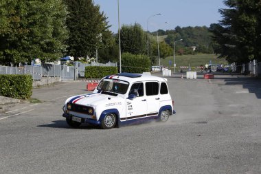 Bibbiano-Reggio Emilia Italy - 07 15 2015 : Free rally of vintage cars in the town square Renault R4. High quality photo