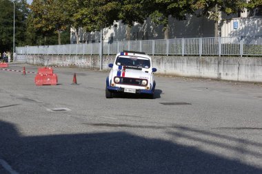 Bibbiano-Reggio Emilia Italy - 07 15 2015 : Free rally of vintage cars in the town square Renault R4. High quality photo