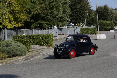 Bibbiano-Reggio Emilia Italy - 07 15 2015 : Free rally of vintage cars in the town square Fiat Topolino black. High quality photo