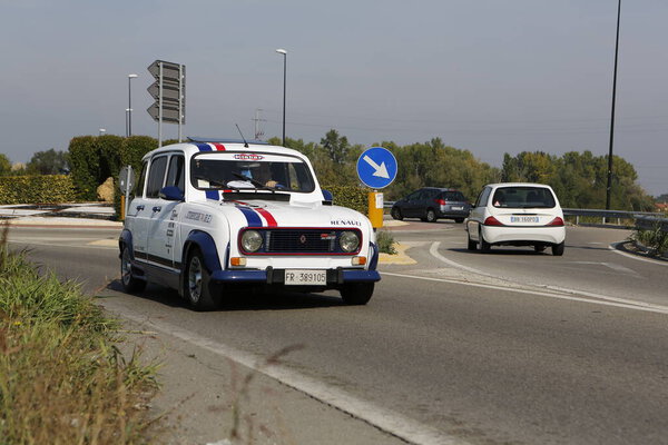 Bibbiano-Reggio Emilia Italy - 07 15 2015 : Free rally of vintage cars in the town square Renault R4. High quality photo