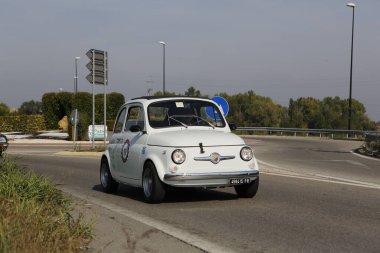 Bibbiano-Reggio Emilia Italy - 07 15 2015 : Free rally of vintage cars in the town square white Fiat 500. High quality photo