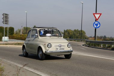 Bibbiano-Reggio Emilia Italy - 07 15 2015 : Free rally of vintage cars in the town square white Fiat 500. High quality photo