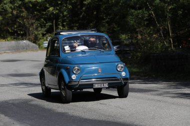 Bibbiano-Reggio Emilia Italy - 07 15 2015 : Free rally of vintage cars in the town square fiat 500 blue. High quality photo