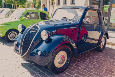 Bibbiano-Reggio Emilia Italy - 07 15 2015 : Free rally of vintage cars in the town square Fiat Topolino. High quality photo