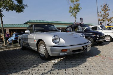 Bibbiano-Reggio Emilia Italy - 07 15 2015 : Free rally of vintage cars in the town square Alfa Romeo Duetto. High quality photo