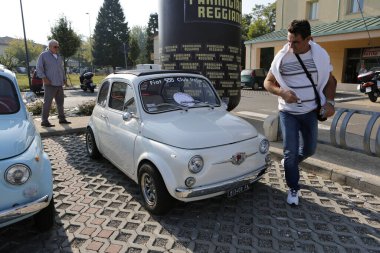 Bibbiano-Reggio Emilia Italy - 07 15 2015 : Free rally of vintage cars in the town square white Fiat 500. High quality photo
