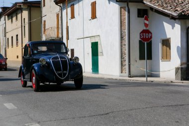 Bibbiano-Reggio Emilia Italy - 07 15 2015 : Free rally of vintage cars in the town square Fiat Topolino. High quality photo