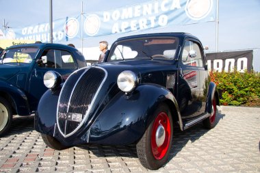 Bibbiano-Reggio Emilia Italy - 07 15 2015 : Free rally of vintage cars in the town square Fiat Topolino. High quality photo