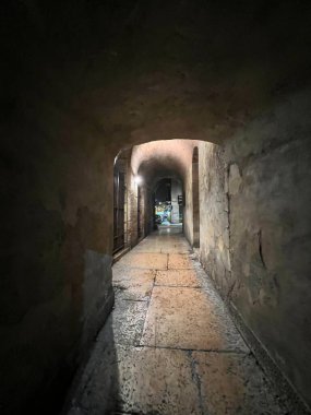 alleys in the center of Verona illuminated at night. High quality photo