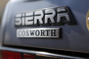 Bibbiano-Reggio Emilia Italy - 07 15 2015 : Free rally of vintage cars in the town square Ford Sierra Cosworth logo. High quality photo