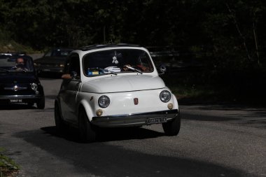 Bibbiano-Reggio Emilia Italy - 07 15 2015 : Free rally of vintage cars in the town square white Fiat 500. High quality photo