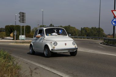 Bibbiano-Reggio Emilia Italy - 07 15 2015 : Free rally of vintage cars in the town square white Fiat 500. High quality photo