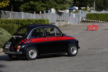 Bibbiano-Reggio Emilia Italy - 07 15 2015 : Free rally of vintage cars in the town square Fiat 500 black. High quality photo