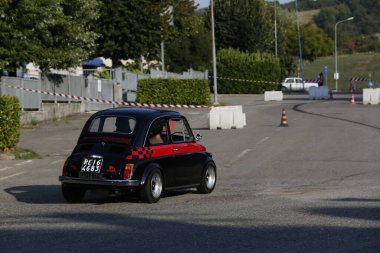 Bibbiano-Reggio Emilia Italy - 07 15 2015 : Free rally of vintage cars in the town square Fiat 500 black. High quality photo